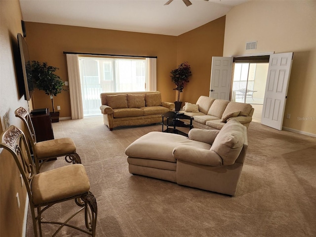21008 Sunpoint Way Unit 204, Lutz, FL 33558 - living room featuring visible vents, a ceiling fan, lofted ceiling, and light carpet