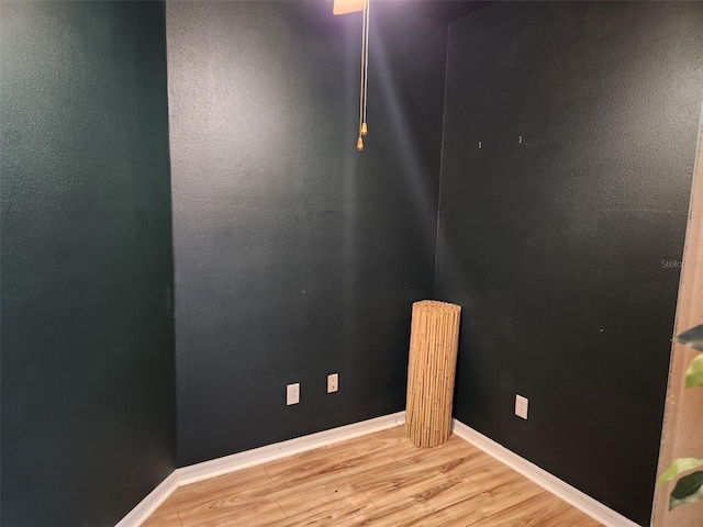 21008 Sunpoint Way Unit 204, Lutz, FL 33558 - unfurnished room with baseboards and wood finished floors