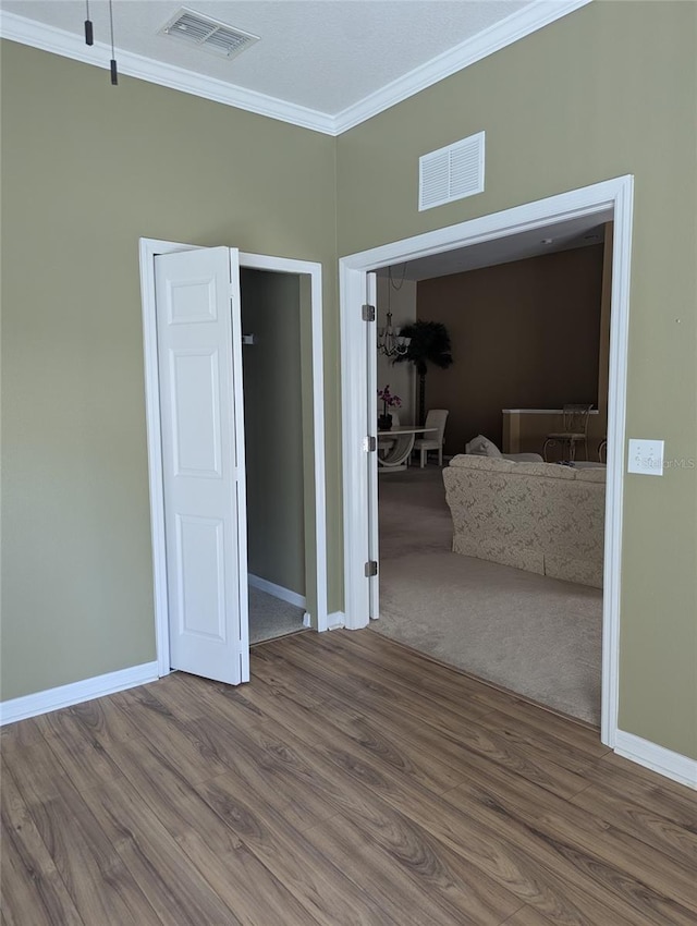 21008 Sunpoint Way Unit 204, Lutz, FL 33558 - interior space with ornamental molding, wood finished floors, and visible vents