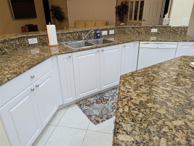 21008 Sunpoint Way Unit 204, Lutz, FL 33558 - kitchen featuring white cabinets, a sink, dishwasher, dark stone counters, and light tile patterned floors
