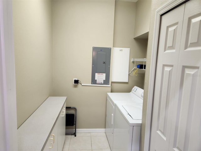 21008 Sunpoint Way Unit 204, Lutz, FL 33558 - washroom featuring laundry area, separate washer and dryer, baseboards, light tile patterned floors, and electric panel
