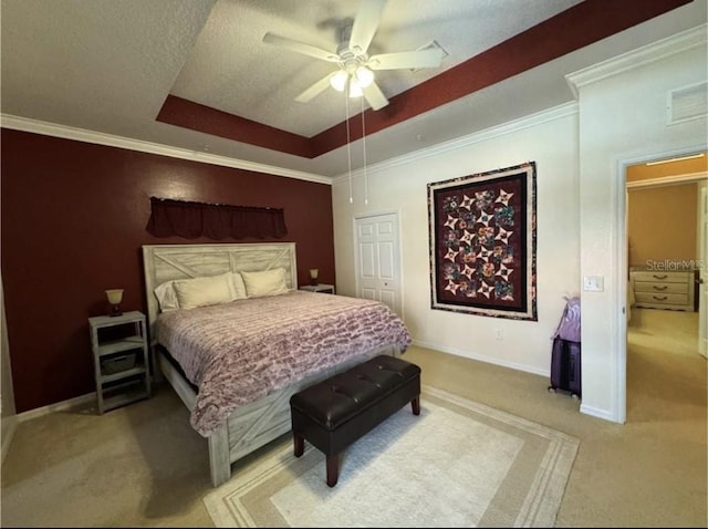 21008 Sunpoint Way Unit 204, Lutz, FL 33558 - bedroom featuring visible vents, light carpet, baseboards, a raised ceiling, and a ceiling fan
