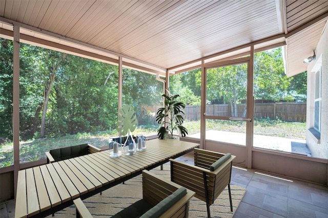 2660 Orangewood Ct, Palm Harbor, FL 34684 - sunroom with outdoor dining space