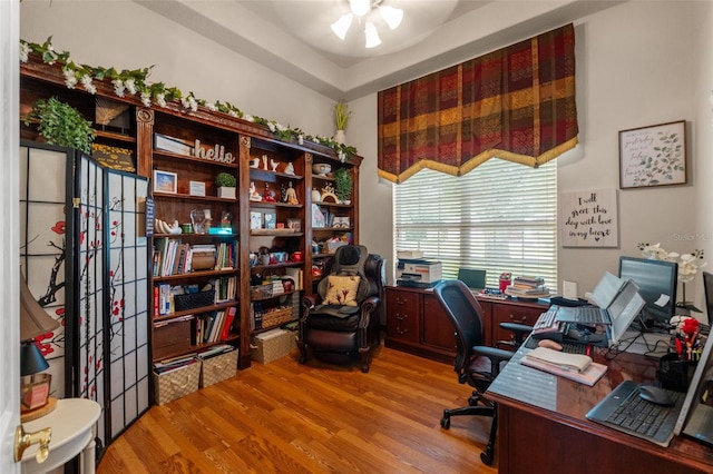 home office with ceiling fan and wood finished floors