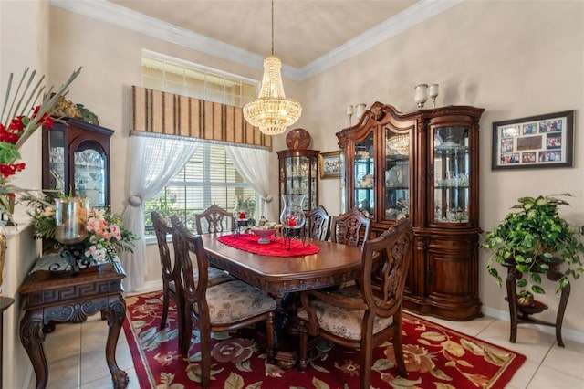dining area featuring crown molding, baseboards, a chandelier, and tile patterned flooring