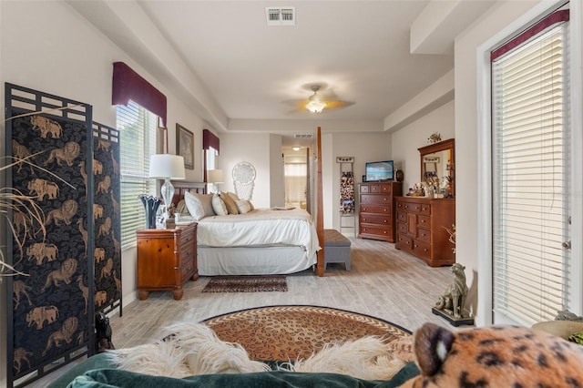 bedroom with wood finished floors and visible vents