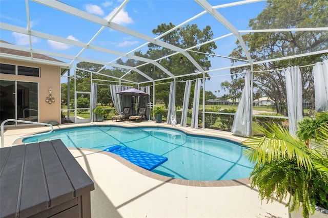 outdoor pool with a patio and a lanai