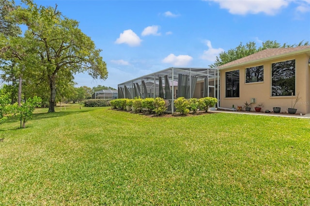 view of yard with a lanai