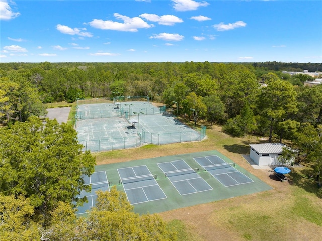 birds eye view of property with a wooded view