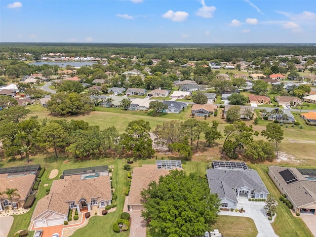 drone / aerial view with a water view and a residential view
