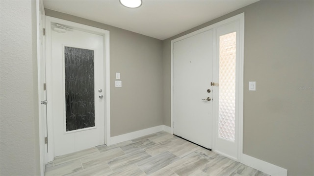 8522 Inwood Dr, Hudson, FL 34667 - entrance foyer featuring baseboards and light wood finished floors