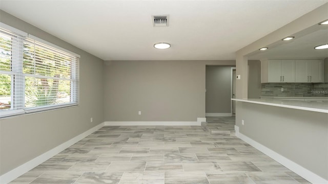8522 Inwood Dr, Hudson, FL 34667 - spare room with visible vents, recessed lighting, and baseboards