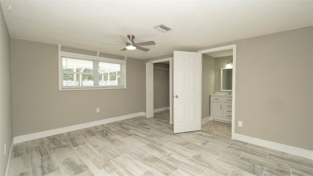 8522 Inwood Dr, Hudson, FL 34667 - unfurnished bedroom with a closet, baseboards, a ceiling fan, and visible vents
