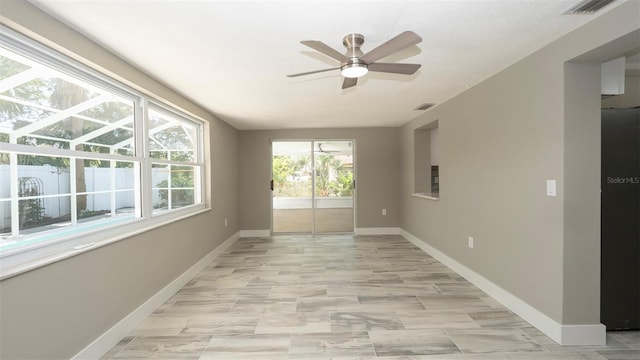 8522 Inwood Dr, Hudson, FL 34667 - spare room featuring baseboards and visible vents