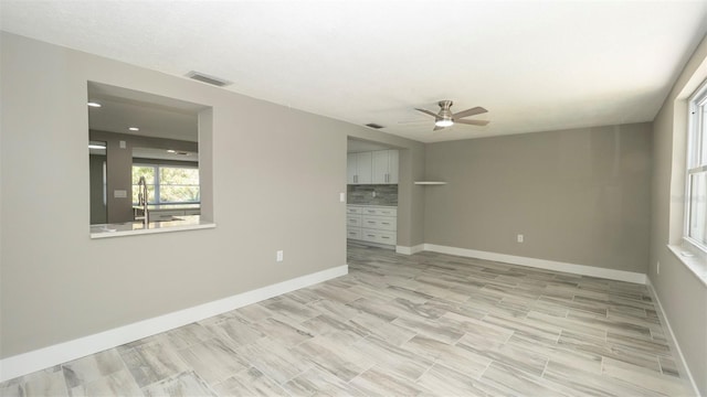 8522 Inwood Dr, Hudson, FL 34667 - empty room featuring baseboards, a ceiling fan, and visible vents