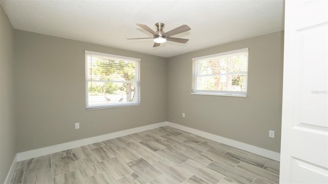 8522 Inwood Dr, Hudson, FL 34667 - unfurnished room featuring a ceiling fan, baseboards, and a healthy amount of sunlight
