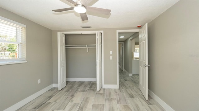 8522 Inwood Dr, Hudson, FL 34667 - unfurnished bedroom with a ceiling fan, visible vents, baseboards, a closet, and light wood finished floors