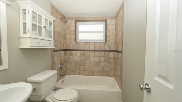 8522 Inwood Dr, Hudson, FL 34667 - bathroom featuring toilet, a sink, and shower / bathing tub combination
