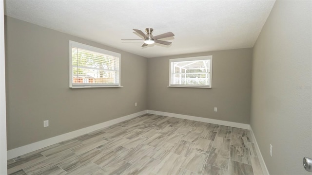 8522 Inwood Dr, Hudson, FL 34667 - unfurnished room featuring a ceiling fan, wood finish floors, and plenty of natural light