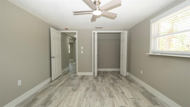 8522 Inwood Dr, Hudson, FL 34667 - unfurnished bedroom featuring a closet, baseboards, wood finish floors, and visible vents