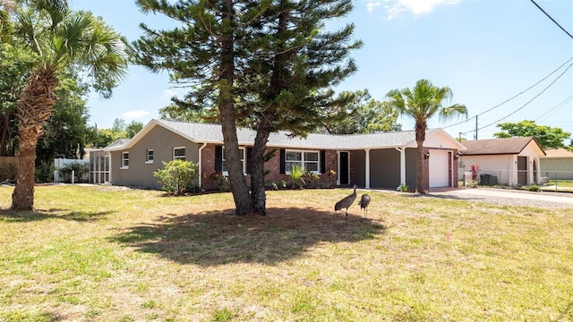 8522 Inwood Dr, Hudson, FL 34667 - single story home with driveway, a garage, fence, a front lawn, and stucco siding