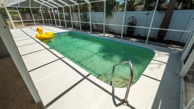 8522 Inwood Dr, Hudson, FL 34667 - view of swimming pool with a fenced in pool, a fenced backyard, a patio area, and a lanai