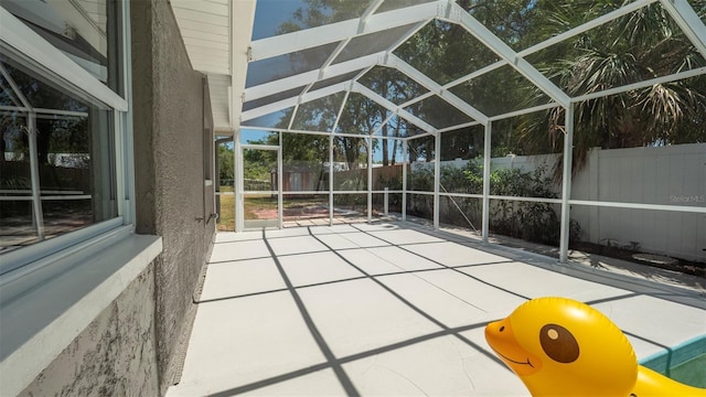 8522 Inwood Dr, Hudson, FL 34667 - view of patio with a fenced backyard and glass enclosure