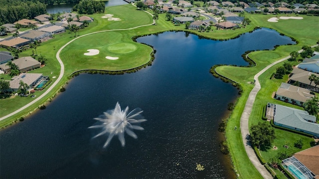 aerial perspective of suburban area featuring a nearby body of water and a golf club