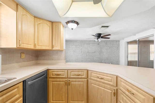 kitchen featuring light countertops, light brown cabinets, decorative backsplash, and dishwasher
