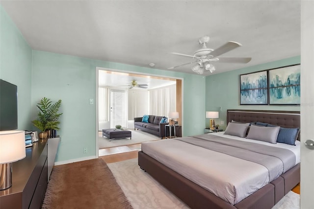 bedroom featuring baseboards and a ceiling fan
