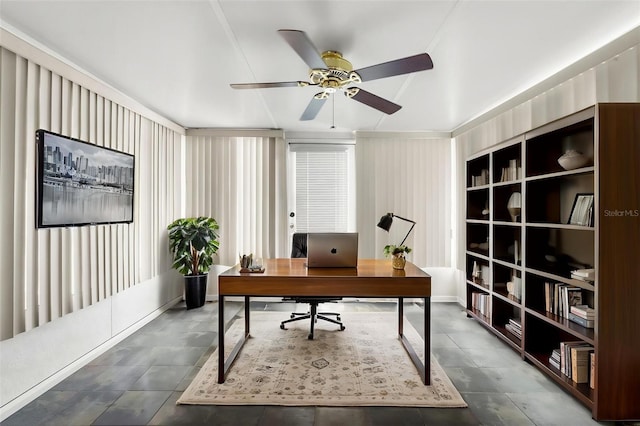 home office with a ceiling fan and tile patterned floors