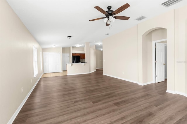 3410 Thistledown Ln, Land O Lakes, FL 34638 - unfurnished living room with a ceiling fan, visible vents, and wood finished floors