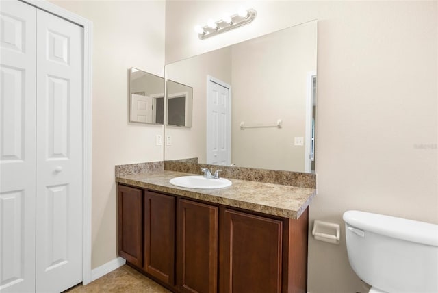 3410 Thistledown Ln, Land O Lakes, FL 34638 - bathroom with toilet, a closet, and vanity