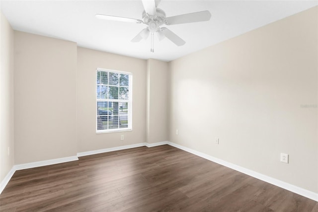 3410 Thistledown Ln, Land O Lakes, FL 34638 - spare room featuring baseboards, dark wood-type flooring, and a ceiling fan