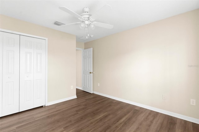 3410 Thistledown Ln, Land O Lakes, FL 34638 - unfurnished bedroom with baseboards, a closet, visible vents, and wood finished floors