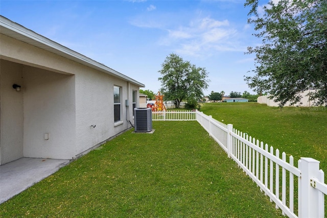 3410 Thistledown Ln, Land O Lakes, FL 34638 - view of yard with central air condition unit and a fenced backyard