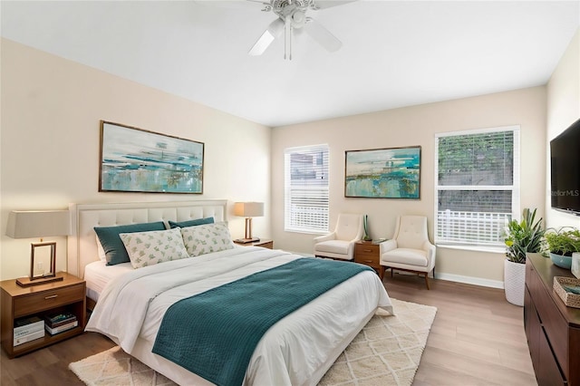 3410 Thistledown Ln, Land O Lakes, FL 34638 - bedroom with wood finished floors, baseboards, and ceiling fan