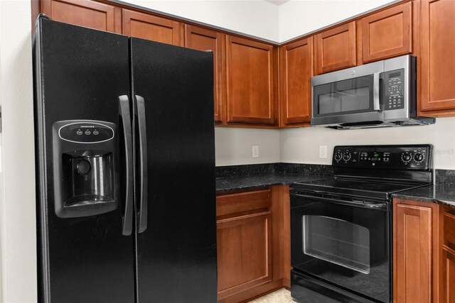 3410 Thistledown Ln, Land O Lakes, FL 34638 - kitchen featuring black appliances, brown cabinets, and dark stone counters