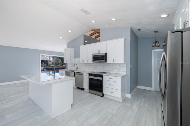 kitchen featuring decorative backsplash, light stone countertops, baseboards, a sink, and stainless steel appliances