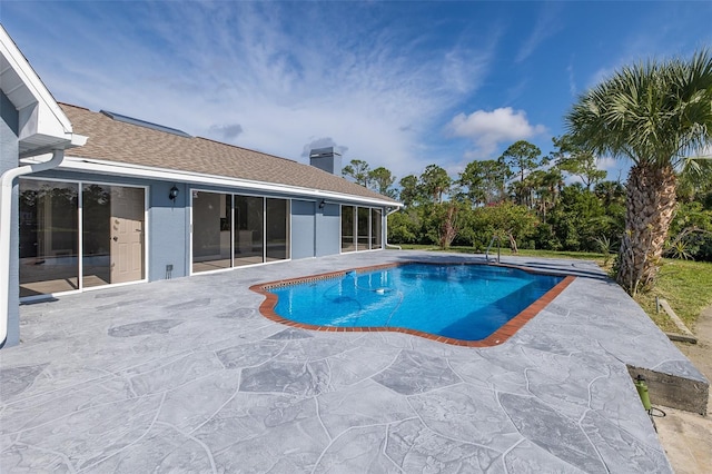 pool with a patio area