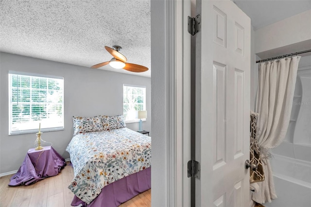 bedroom featuring ceiling fan and wood finished floors