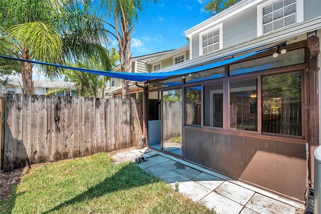 back of property featuring fence