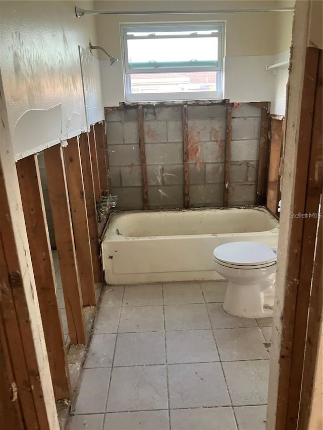 full bathroom with tile patterned flooring and toilet