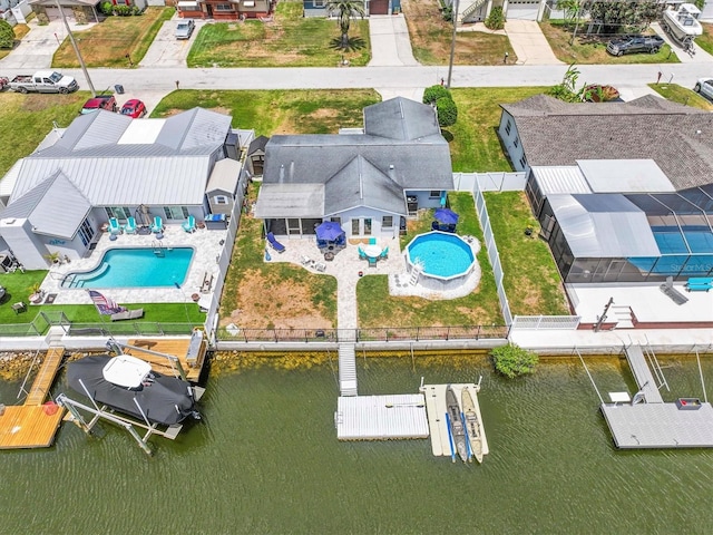 aerial view with a residential view and a water view