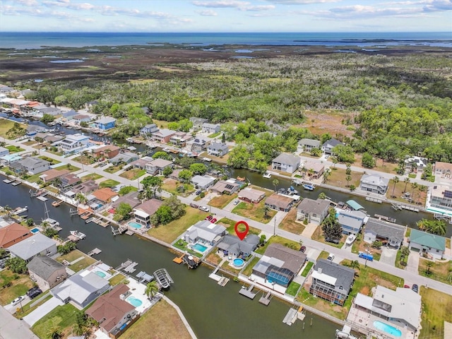 aerial view with a water view and a residential view