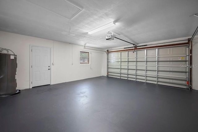 garage featuring a garage door opener and water heater