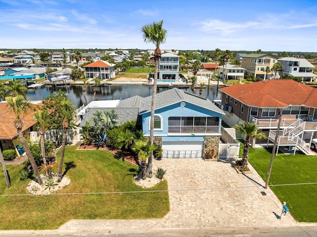aerial view featuring a water view and a residential view