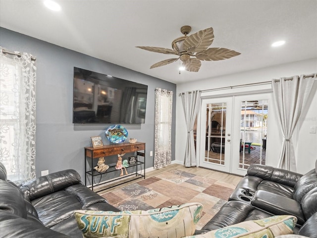 living area with french doors, recessed lighting, baseboards, ceiling fan, and light wood-type flooring