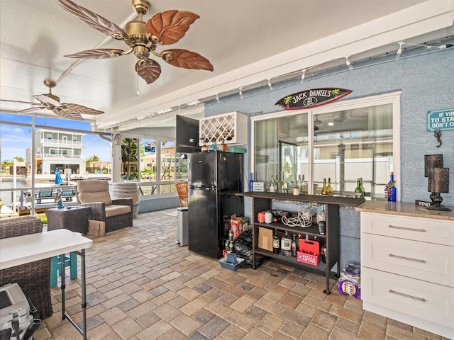 view of patio / terrace featuring ceiling fan