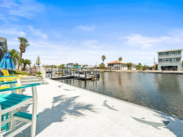 dock area with a water view